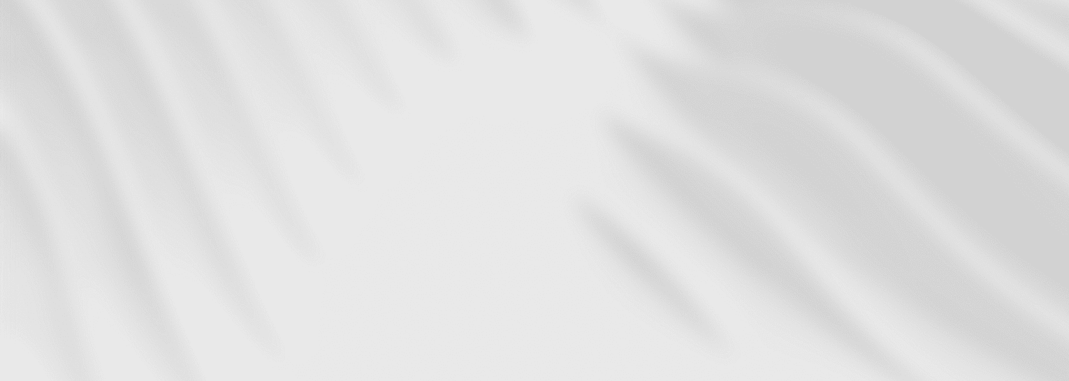 Abstract black and white image featuring blurred, wavy lines across a light gray background.